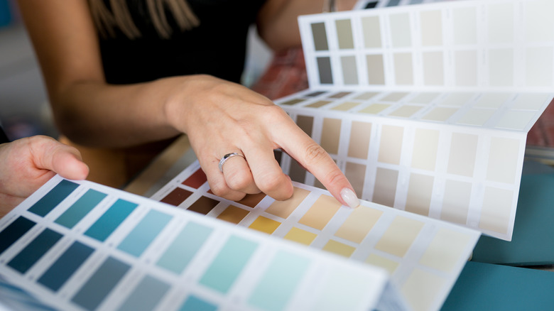woman choosing paint colors