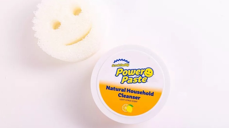 ScrubDaddy PowerPaste and Scrub Mommy sponge on a white counter