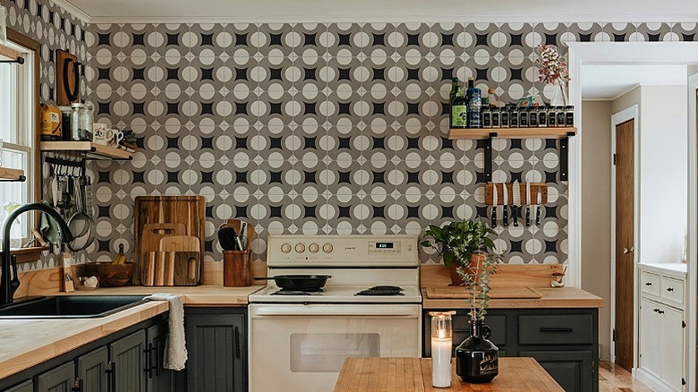 A kitchen backsplash featuring striking encaustic cement tiles