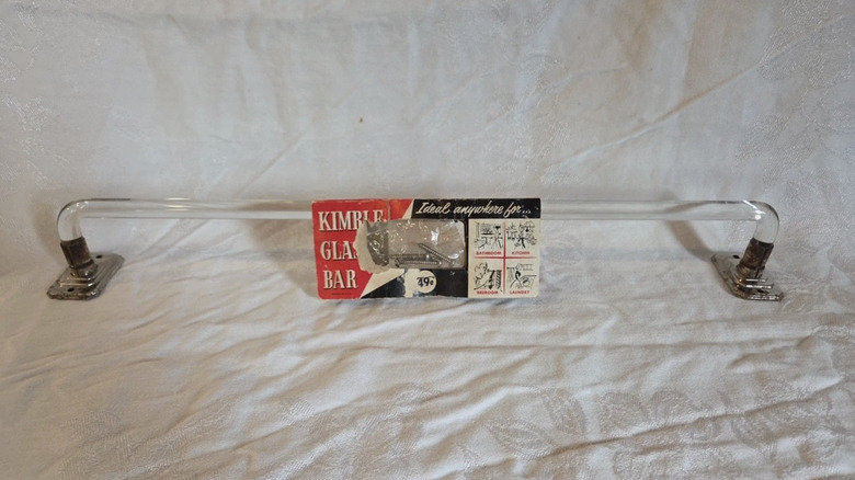 A Kimble glass towel bar in its original packaging