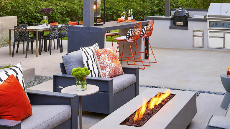 A large custom-built stone outdoor kitchen with integrated barbecue grill