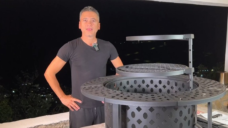 Man standing next to newly assembled Outvue fire pit