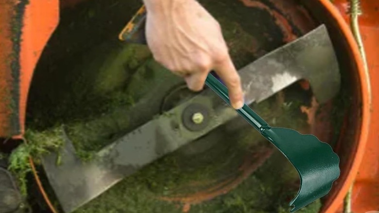 Removing grass with the Xanadued Mower Deck Scraper