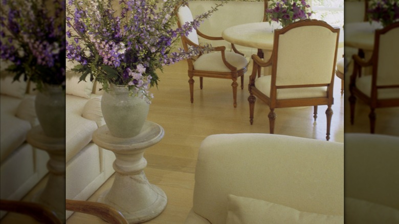 A white marble pedestal with a matching vase on top