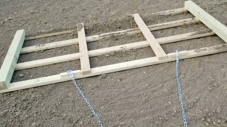 A DIY wood pallet drag harrow