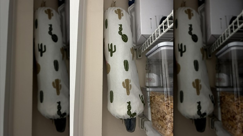 SWISSELITE's Reusable Plastic Bag Holder hanging in a pantry