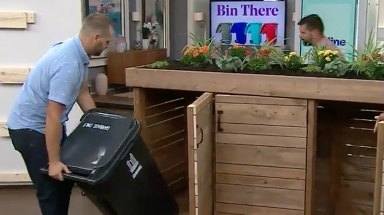 Putting an outdoor trash can into the DIY cabinet