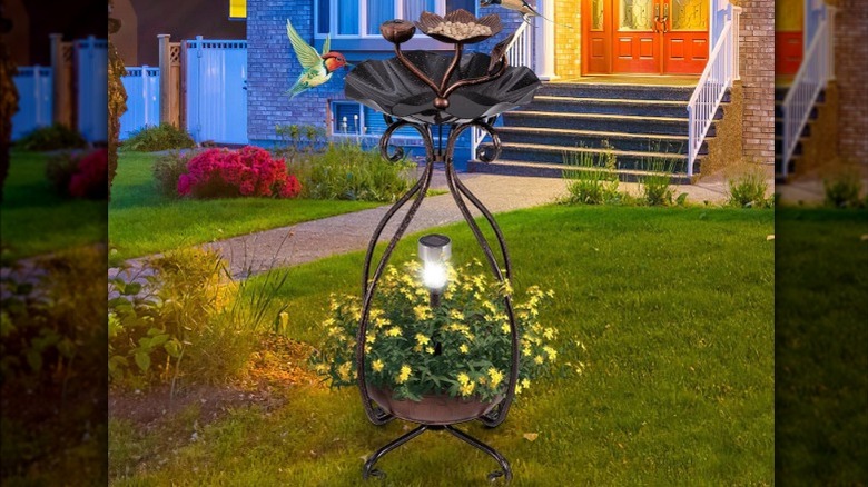 Giantex Bird Bath with Planter and solar light on display in the yard
