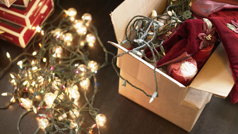 A box full of Christmas lights and candles
