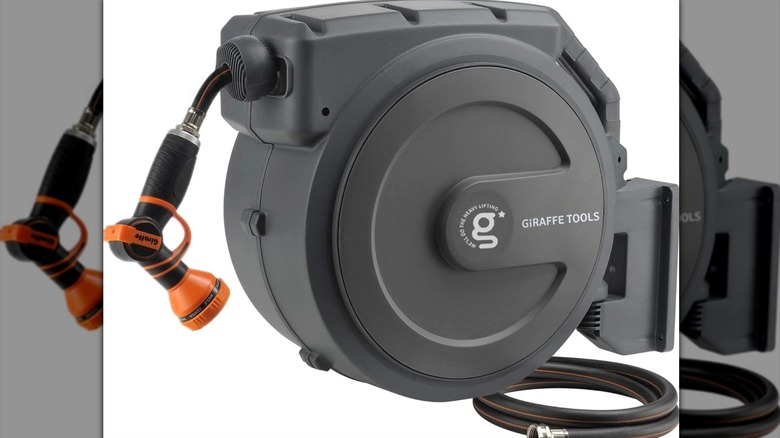 Retractable hose reel on white background