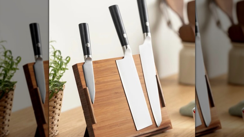 IKEA knife block on kitchen counter, holding three knives