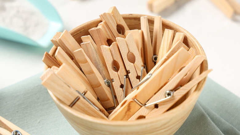 A bowl of wooden clothespins