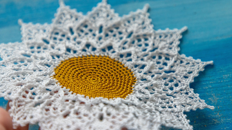 A photo of a vintage doily on a table.