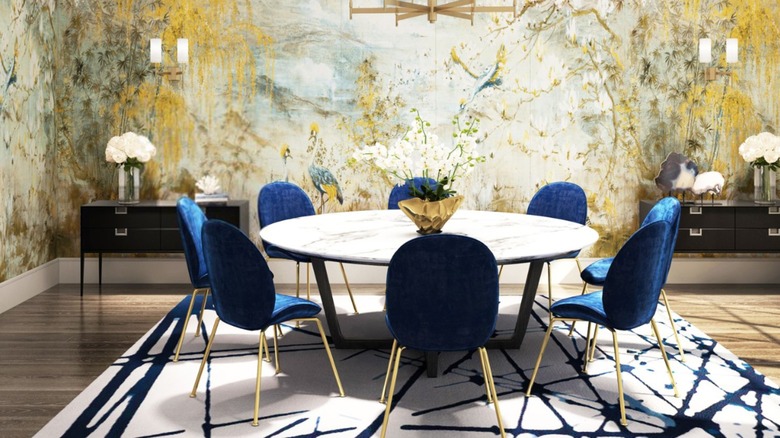 A modern dining room features a chinoiserie grasscloth-printed mural of cranes.