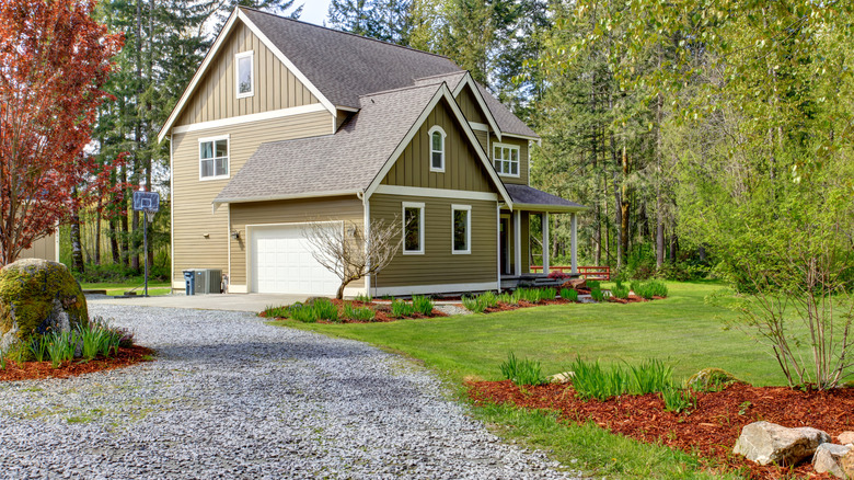 Gravel driveway leading to house