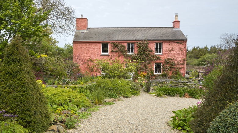 A wide gravel path leading to a house