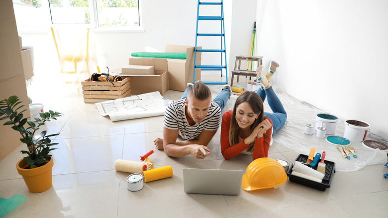 couple looking at computer in new home