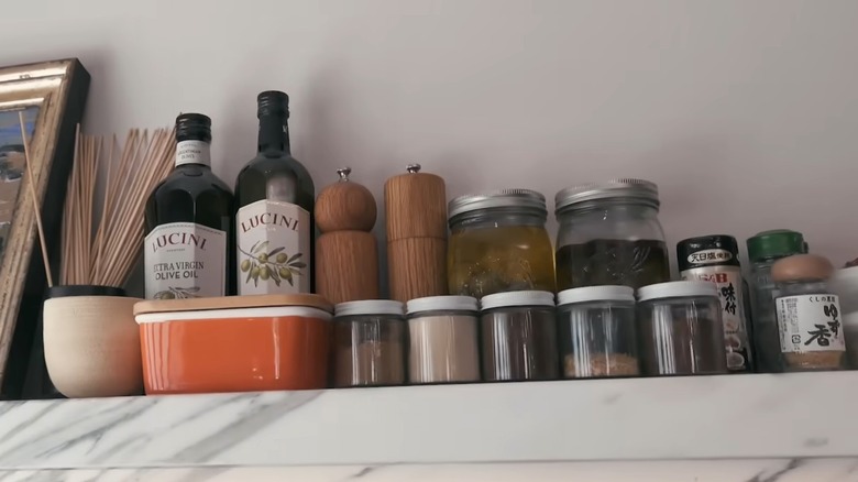 Interior of a modern kitchen with jars and other items on the counter.