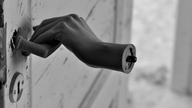 hand on door
