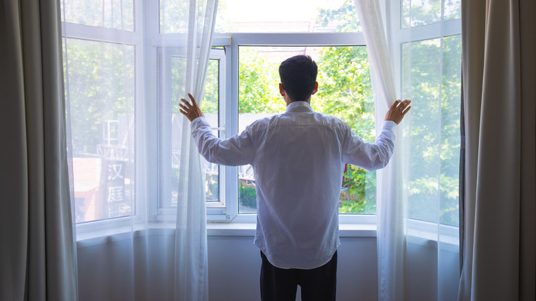 lightweight curtains billow in wind