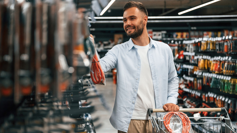 Man shopping for tools in hardware store