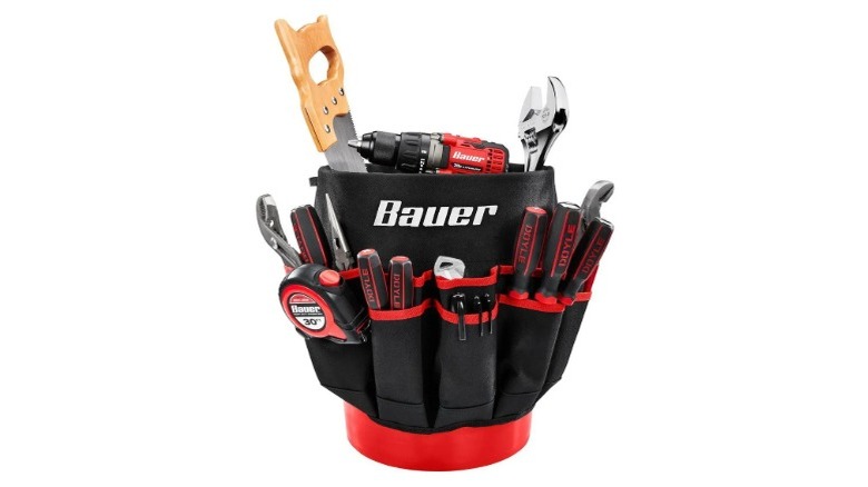 Bauer bucket tool bag with pockets filled with various home repair tools.