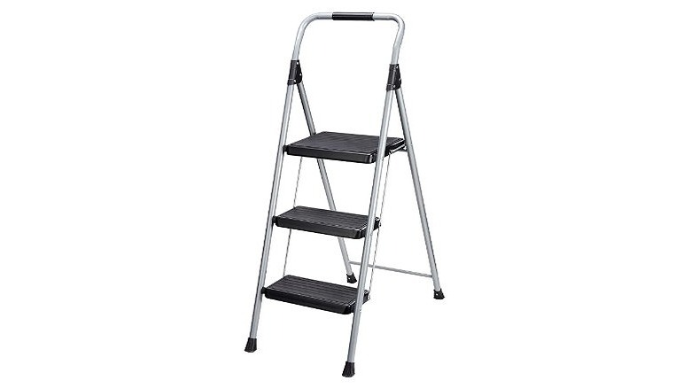 Step ladder with three black steps and silver frame.