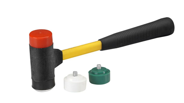 The Pittsburgh convertable hammer with two interchangeable heads next to it.