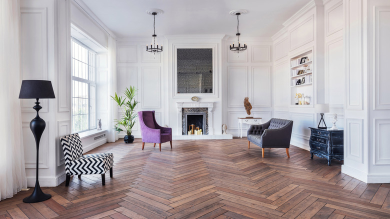 Parquet floor in a white paneled living room