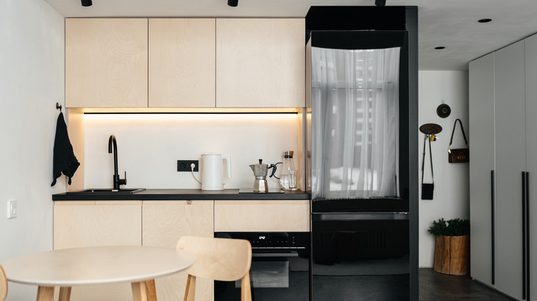 A kitchen with plywood cabinets