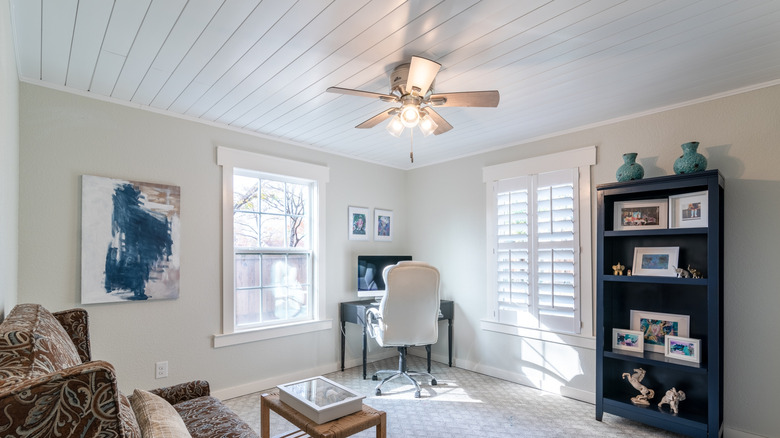 A room with a fresh shiplap ceiling installed in white