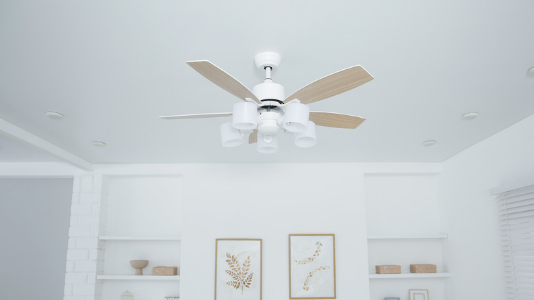 Bedroom ceiling with ceiling fan installed