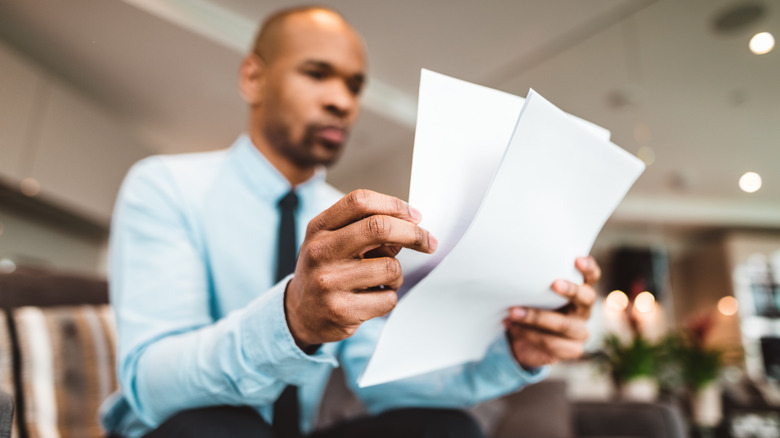 Man looking at papers