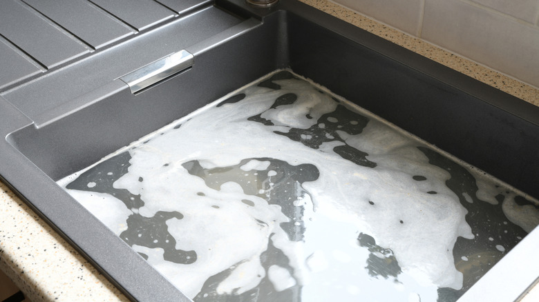 Close-up of a clogged kitchen sink