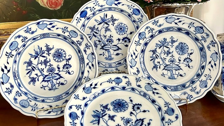 Collection of white and blue china from Meissen in the pattern known as Blue Onion for the onion-shaped flowers in its borders.