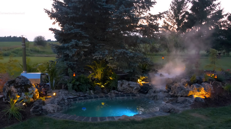 a natural hot spring build in the backyard