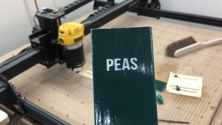 a garden sign for peas made from vinyl blinds using a CNC machine
