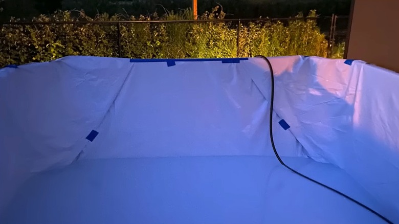 DIY pool covered with white lining
