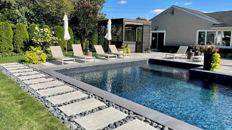inground rectangular pool in backyard