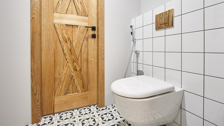 Toilet with in-wall tank