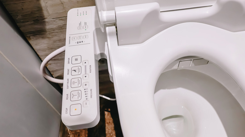 Electronic bidet toilet seat on a white bowl