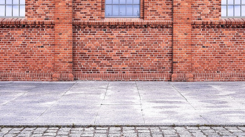 Concrete space outside a brick building