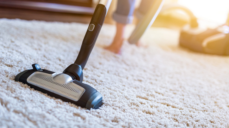 vacuum cleaning carpet