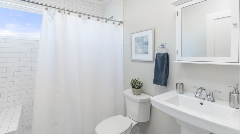 white shower curtain in bathroom
