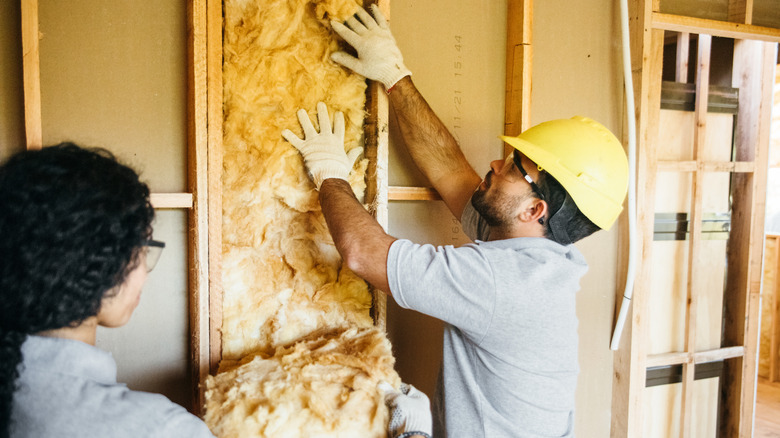 men installing insulation