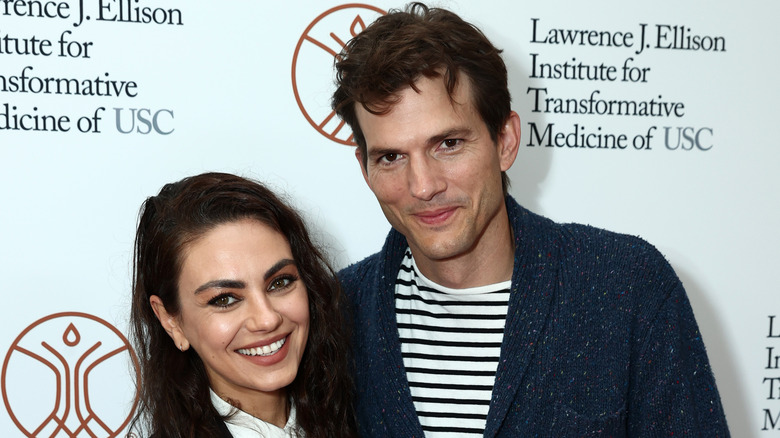 Mila Kunis and Ashton Kutcher smiling