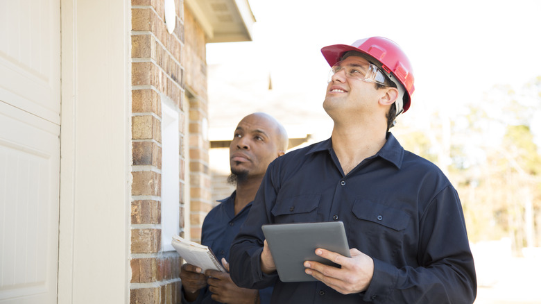 pest control inspectors watching the home