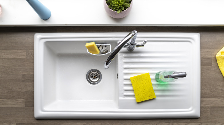 kitchen sink with cleaning supplies