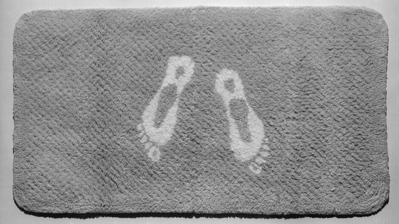 Footprints on a wet bathroom mat