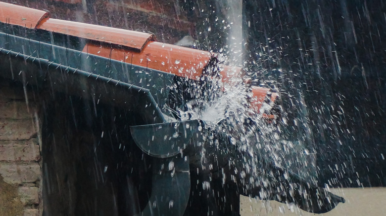 overflowing gutter on house